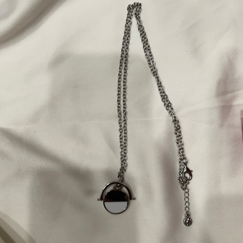 Silver necklace.